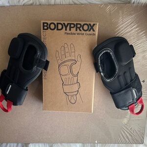 Black Flexible Wrist Guards with Red Pull Tabs